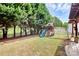 Grass backyard with playset, providing a fun outdoor space at 1001 Serel Dr, Matthews, NC 28104