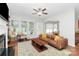 Spacious living room featuring a fireplace and access to backyard at 1001 Serel Dr, Matthews, NC 28104