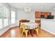 Bright dining room with yellow chairs and large window at 1001 Serel Dr, Matthews, NC 28104