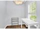 Small office space with a white desk and shelving unit at 1001 Serel Dr, Matthews, NC 28104