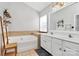Bathroom with double vanity and garden tub at 1001 Serel Dr, Matthews, NC 28104