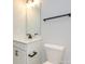 Simple bathroom with single vanity, toilet, and black accents at 10507 Boudreaux St, Huntersville, NC 28078