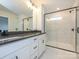 Modern bathroom with double vanity, marble shower, and black accents at 10507 Boudreaux St, Huntersville, NC 28078