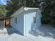Light blue house with attached garage and covered porch at 2209 Laura Dr, Charlotte, NC 28212