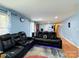 Spacious living area with reclining sofas and a view down the hallway at 2209 Laura Dr, Charlotte, NC 28212