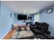 Relaxing living room with reclining sofas and a large TV at 2209 Laura Dr, Charlotte, NC 28212