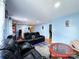 Spacious living room with reclining sofas, hardwood floors, and a view of the hallway at 2209 Laura Dr, Charlotte, NC 28212