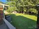 Large backyard with shed and mature trees at 2650 31St Street Ne Ct, Hickory, NC 28601