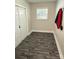 Laundry area with double doors and wood-look flooring at 2650 31St Street Ne Ct, Hickory, NC 28601