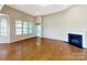 Living room with hardwood floors, fireplace and large windows at 112 Brooke Forest Ct, Mooresville, NC 28115