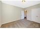 Bright bedroom with double door closet and view of hallway at 120 Brooke Forest Ct, Mooresville, NC 28115