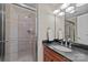 Clean bathroom with shower, vanity, and dark countertop at 4721 Morehead Rd # 409, Concord, NC 28027