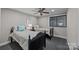 Charming bedroom with two twin beds, ceiling fan, and window coverings at 4721 Morehead Rd # 409, Concord, NC 28027