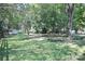 Large backyard with mature trees and a storage shed at 11334 Longhedge Ln, Charlotte, NC 28273