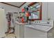 Laundry room with washer, dryer, and storage shelving at 225 Frye Hts, Taylorsville, NC 28681