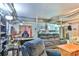 Finished basement with a gray couch, and a work desk and chair at 225 Frye Hts, Taylorsville, NC 28681