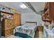 Basement bedroom with wood dresser, and double bed with teal comforter at 225 Frye Hts, Taylorsville, NC 28681