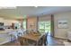 Bright dining area with wooden table and chairs, adjacent to kitchen at 3450 Buck Ct, Gastonia, NC 28056