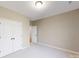 Simple bedroom with double door closet and neutral decor at 213 E Warfield Dr, Mooresville, NC 28115