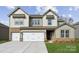 Two-story house with a neutral color scheme and a two-car garage at 213 E Warfield Dr, Mooresville, NC 28115