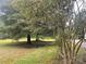 Mature trees and grassy yard landscape at 1700 St Johns Church Rd, Concord, NC 28025