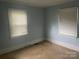 Light blue bedroom with two windows at 1700 St Johns Church Rd, Concord, NC 28025