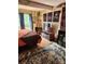 Bedroom with large TV, decorative wall hangings, and rug at 5012 Sardis Rd # D, Charlotte, NC 28270