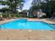 Community pool with plenty of lounge chairs for relaxing at 5012 Sardis Rd # D, Charlotte, NC 28270