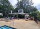 Community pool with deck and lounge chairs at 5012 Sardis Rd # D, Charlotte, NC 28270