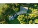 Aerial view showing house and detached workshop on wooded lot at 1235 Bob Falls Dr, Shelby, NC 28150