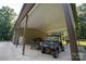 Covered parking for cars and ATV with workshop area at 1235 Bob Falls Dr, Shelby, NC 28150