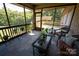 Relaxing screened porch with patio furniture and view of backyard at 1235 Bob Falls Dr, Shelby, NC 28150