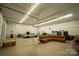 Finished garage with sectional sofa and space for vehicles at 1235 Bob Falls Dr, Shelby, NC 28150