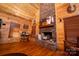 Living room with stone fireplace and hardwood floors at 1235 Bob Falls Dr, Shelby, NC 28150