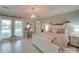 Charming bedroom with a queen-size bed, vanity and window seat at 540 Harbor Rd, Norwood, NC 28128