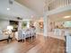 Open living room with hardwood floors, fireplace, and neutral-toned furniture at 540 Harbor Rd, Norwood, NC 28128