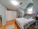 Bright bedroom with hardwood floors and ample closet space at 540 Harbor Rd, Norwood, NC 28128