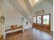 Bright entryway with wooden floors, a bench, and stairs at 540 Harbor Rd, Norwood, NC 28128