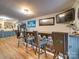 Game room bar with seating and Carolina Panthers decor at 540 Harbor Rd, Norwood, NC 28128