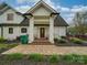 Front entrance with a covered porch and brick walkway at 540 Harbor Rd, Norwood, NC 28128