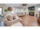 Spacious living room featuring hardwood floors, fireplace, and comfortable sofas at 540 Harbor Rd, Norwood, NC 28128