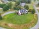 Aerial view of a two-story house with a large green lawn at 540 Harbor Rd, Norwood, NC 28128