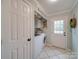 Convenient laundry room with washer, dryer, and exterior access at 540 Harbor Rd, Norwood, NC 28128