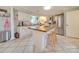 Kitchen with white cabinets, butcher block island, and stainless steel appliances at 540 Harbor Rd, Norwood, NC 28128