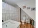 Small bathroom with toilet, sink, and shower with a ruffled curtain at 540 Harbor Rd, Norwood, NC 28128
