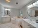 Bathroom with double vanity, corner bathtub, and tile flooring at 540 Harbor Rd, Norwood, NC 28128