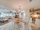 Bright dining area with farmhouse table and chairs, open to living room at 540 Harbor Rd, Norwood, NC 28128