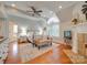 Main bedroom with a king-size bed, fireplace, and hardwood floors at 540 Harbor Rd, Norwood, NC 28128
