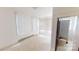 Simple bedroom with carpet and access to bathroom at 309 Elm St, Marshville, NC 28103