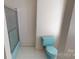 Bathroom with shower and light blue toilet at 309 Elm St, Marshville, NC 28103